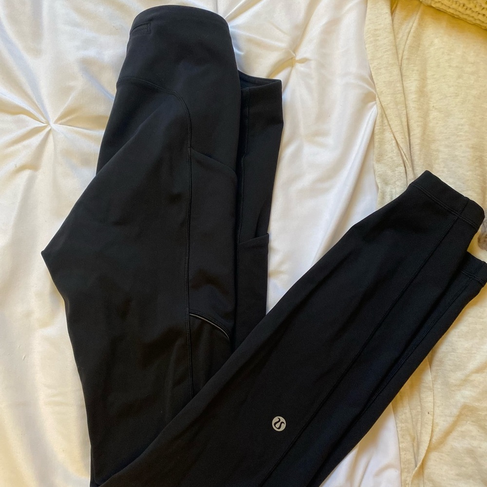 LULULEMON black leggings w/ pockets and zippers.